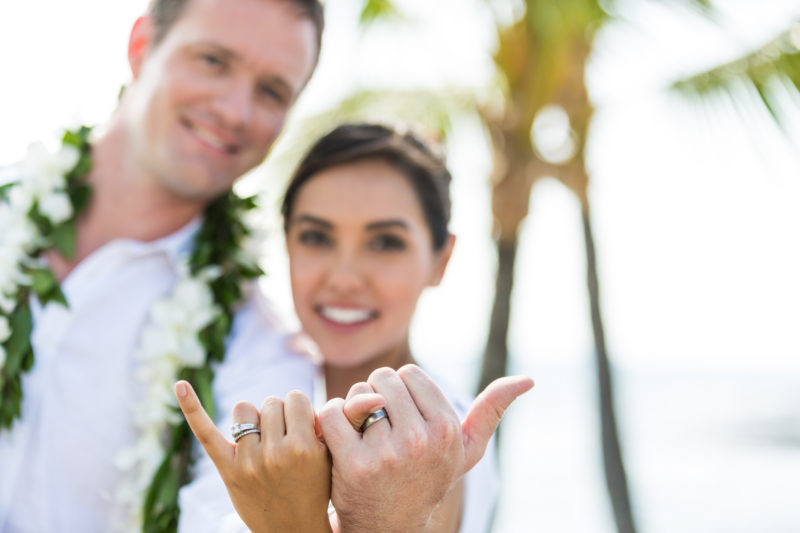 Newlyweds throwing a shaka after their wedding. Photo Credit: Hawaii Tourism Authority (HTA) / Tor Johnson