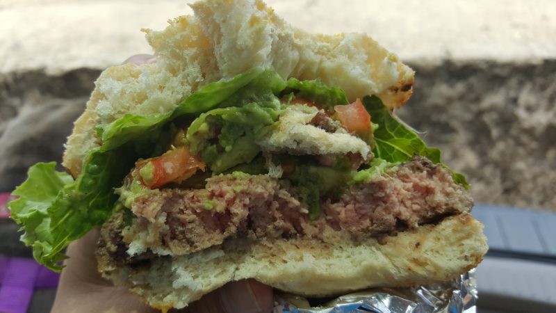 Half-eaten burger from Kua Aina. Hawaii travel. Things to do in Oahu. Things to do in Hawaii.
