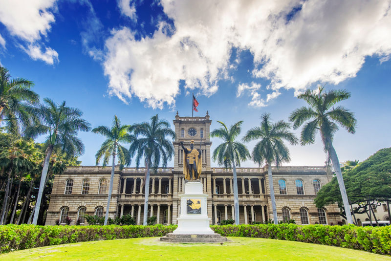 After the Iolani Palace tours, head across the street to the Kamehameha statue.