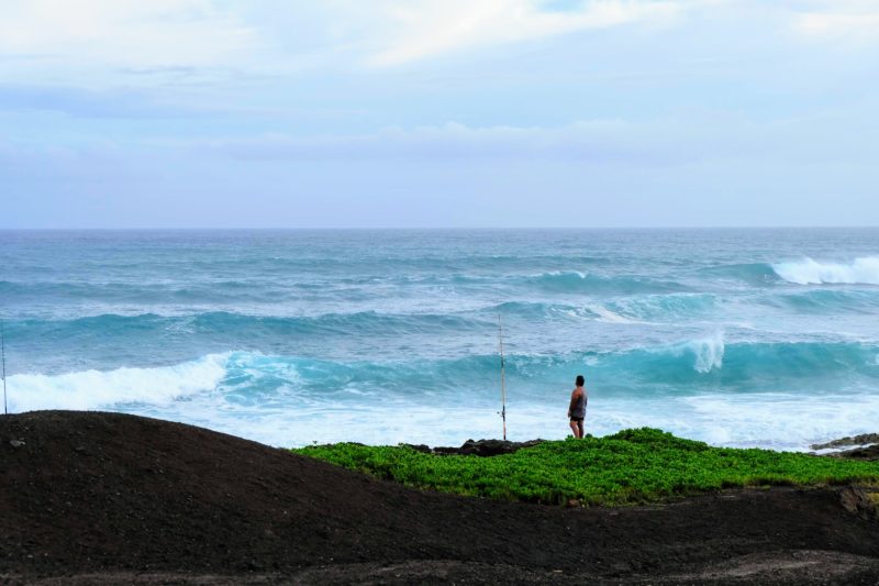 What a view! A lone fisherman admiring the view.