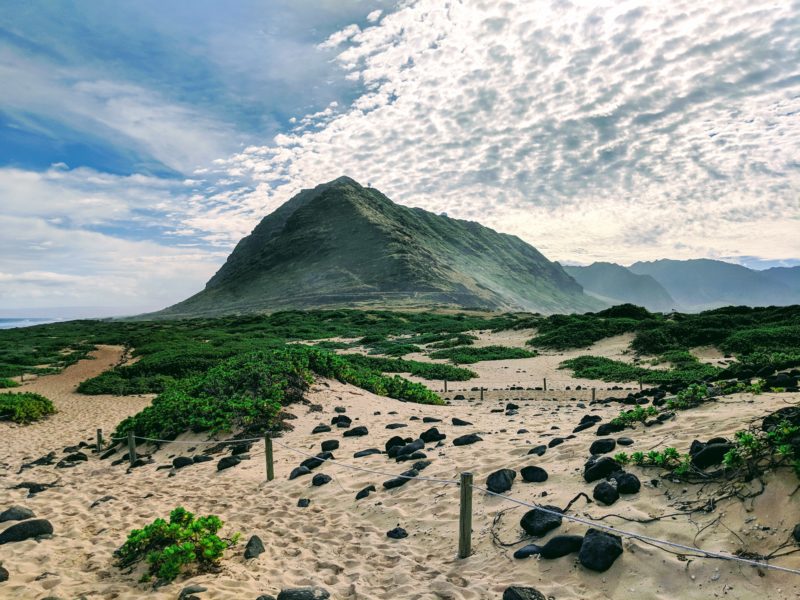 Standing at Kaena Point and facing the Waianae mountain range.