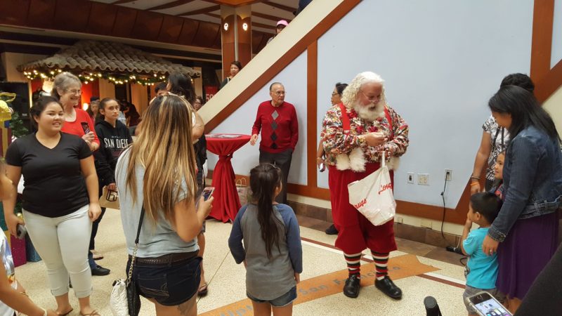 Santa giving out candy at Pearlridge Center - a mall popular with locals.