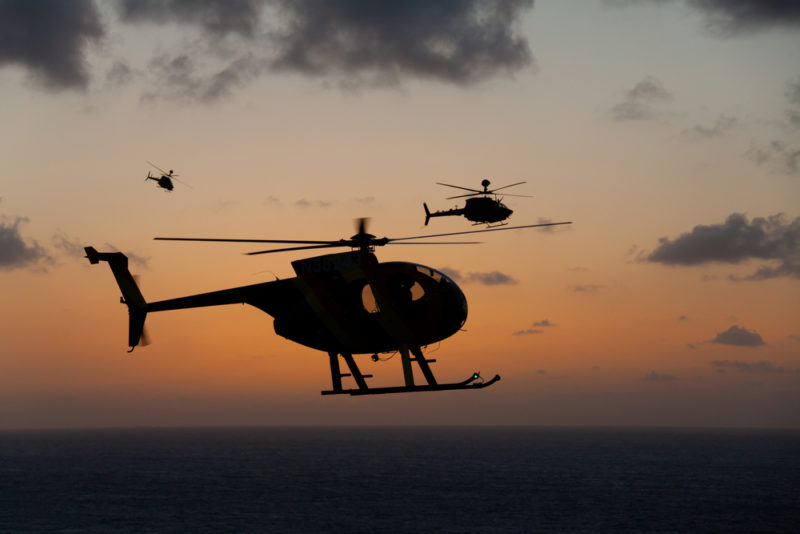 Helicopters in the Hawaii sunset.