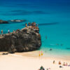 The "jumping rock" at Waimea Bay. The Best Beaches In Oahu’s North Shore For Families.
