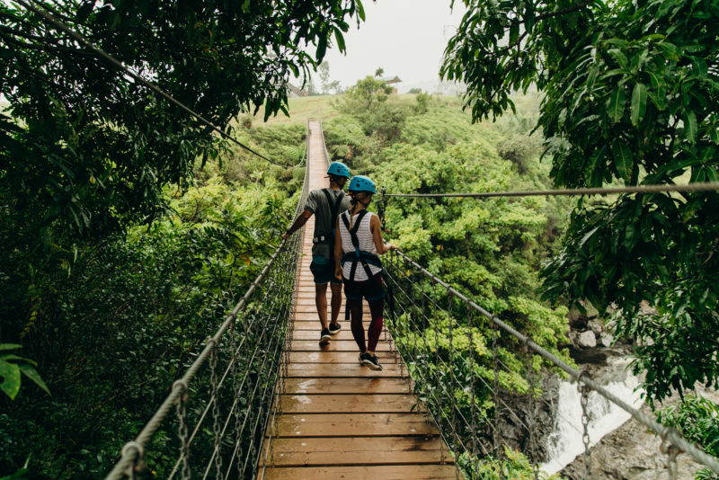 Crossing bridges between ziplines.