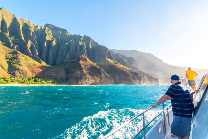 A boat tour of the Na Pali cliffs in Kauai. From the best Hawaiian island to visit for kids.