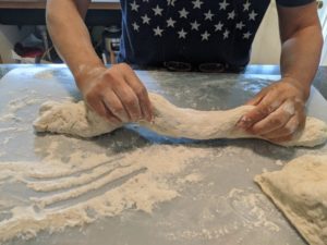 Roll the dough out to a fat noodle.