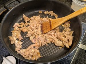 Cook the chicken then remove it from the pan.