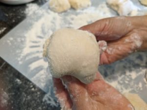 This process makes the bun smooth and circular.