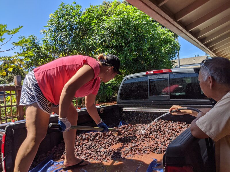 Dad and I rinsing the lava rock.