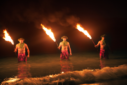 Watching three men and their fireknife performance in Maui.