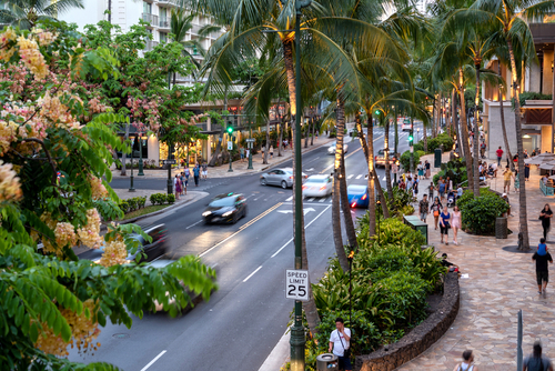 A typical sunny July day for Kuhio Avenue, Waikiki. Editorial credit: Allen.G / Shutterstock.com