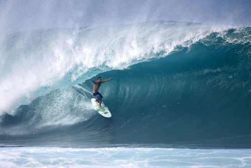 Kalani Chapman competes in the Da Hui Backdoor Shootout at Ehukai Beach (Pipeline). Editorial credit: Mana Photo / Shutterstock.com