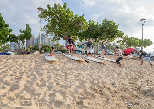 Surfing lessons in Honolulu. Editorial credit: Theodore Trimmer / Shutterstock.com