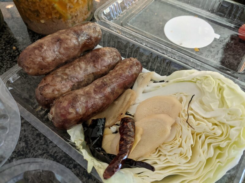 Thai sausages have a sour taste that matches so well with ginger and cabbage.