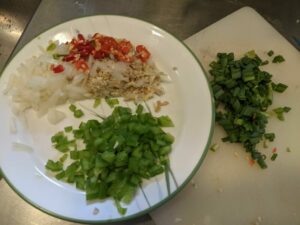 Chopped up some green onions, green bell peppers, onions, garlic, red chili peppers, and chinese parsley (not pictured).