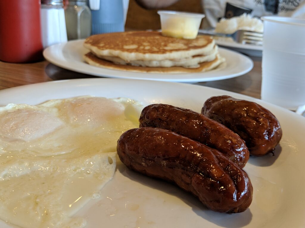 Pancakes, over easy eggs and Scottish bangers.