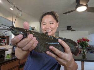 Amy holding a walking catfish.