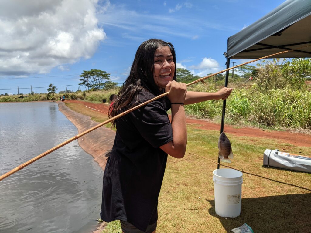 Fishing for the first time at Alii Agriculture farms.