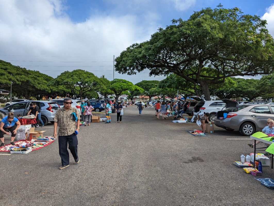 Busy parking lot setting up for a market.