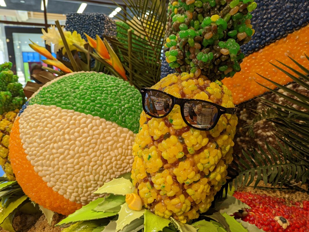 A pineapple and beach ball made out of jelly beans.