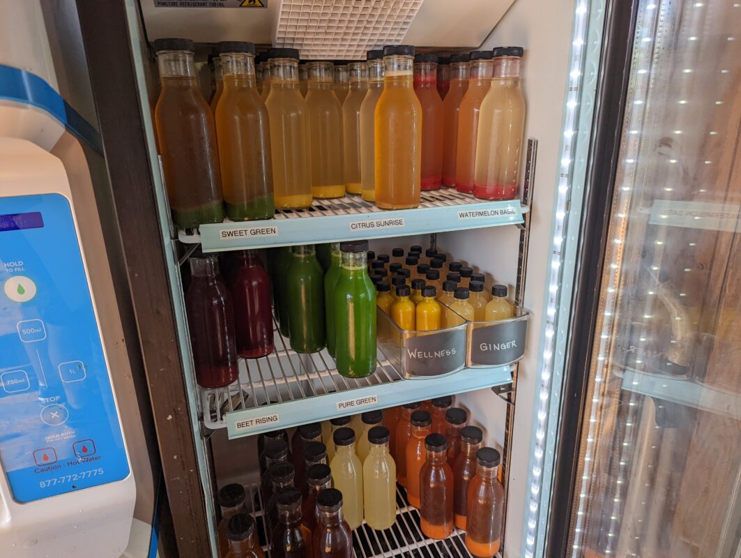 Different juices in a refrigerator.