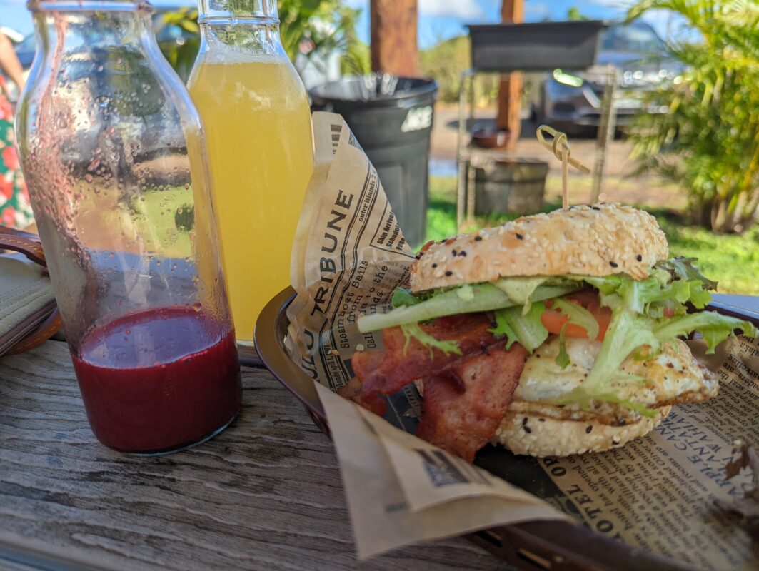 Bagel sandwich and juices.