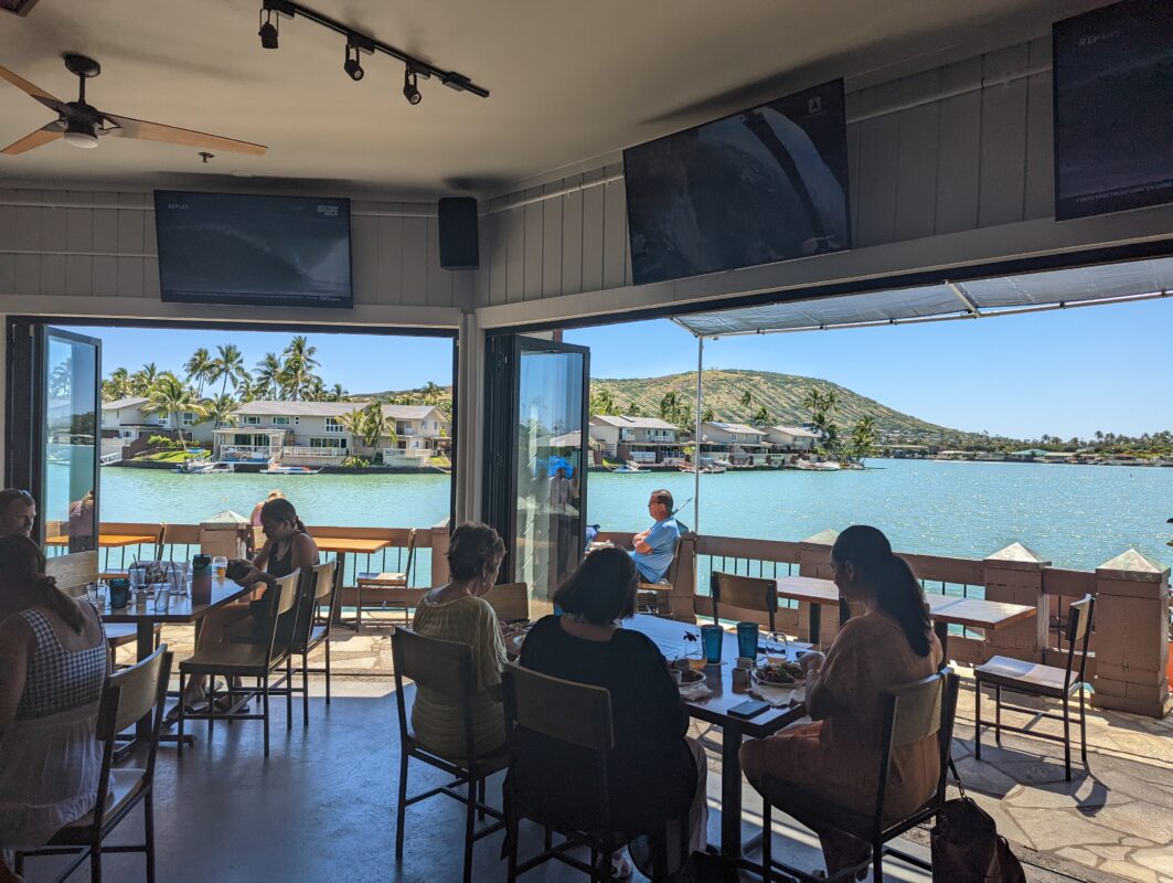 The view of the waterfront from inside a restaurant.